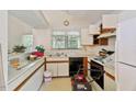 Kitchen with white countertops and cabinets, featuring a black dishwasher and a double sink at 2308 Stonesthrow Ct, Raleigh, NC 27610