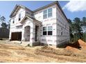 Two-story home featuring builders wrap, awaiting siding, and a two-car garage at 236 Golfview Ave, Benson, NC 27504