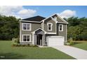 Charming two-story home with stone accents, a covered entry, and an attached garage at 236 Golfview Ave, Benson, NC 27504