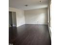 Spacious living room features hardwood floors, neutral paint, and natural light at 2612 Beagle Landing Dr, Raleigh, NC 27610