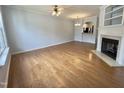 Spacious living area featuring a fireplace, hardwood floors, and neutral color palette at 358 Red Elm Dr, Durham, NC 27713