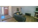 Inviting living room featuring modern flooring, neutral paint, and a cozy fireplace at 400 Southerby Dr, Garner, NC 27529