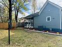 Lush backyard featuring a screen door porch, well-maintained landscaping, and mature trees at 425 Price Ave, Durham, NC 27707