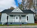 Inviting single-story home showcasing a classic covered front porch and well-maintained landscaping at 425 Price Ave, Durham, NC 27707