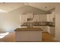 Spacious kitchen with white cabinets and a center island at 529 Mulberry Rd, Spring Hope, NC 27882