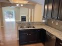 Eat-in kitchen featuring granite countertops and stainless steel appliances at 532 Matheson Pl, Cary, NC 27511