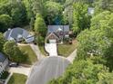 Stunning aerial view of home on a cul-de-sac with a large, private lot at 6 Beltre Ct, Durham, NC 27705