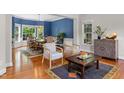 Bright living room with hardwood floors, ample seating, and natural light at 6 Beltre Ct, Durham, NC 27705