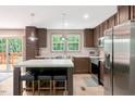 Open kitchen with stainless appliances, a large island, and barstool seating at 6082 Zachary Lane Ln # 1S, Oxford, NC 27565