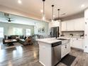Open-concept kitchen features modern stainless steel appliances, granite counters, and breakfast bar at 80 Willow Green Dr, Clayton, NC 27527