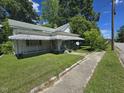 Home with covered porch and tidy lawn, located on a corner lot at 824 Beal St, Rocky Mount, NC 27804