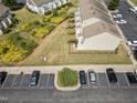 Aerial shot showcasing townhomes, visitor parking, and landscaped grounds in the community at 100 Stratford Lakes Dr # 361, Durham, NC 27713