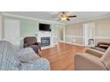 Cozy living room features a fireplace and hardwood floors at 104 Jj Dr, Benson, NC 27504