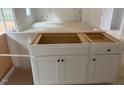 Close up of a bright white kitchen island with room for seating offering a clean look at 11121 Salers Loop, Middlesex, NC 27557