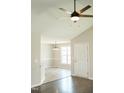 Inviting entryway with wood flooring and a view into the dining area with bright natural light at 12 Linsey Ct, Lillington, NC 27546