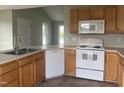 Well-equipped kitchen featuring stainless steel appliances, light wood cabinets, and durable countertops at 12 Linsey Ct, Lillington, NC 27546