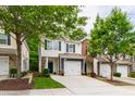 Charming two-story home with a well-manicured lawn, attached garage, and inviting curb appeal at 1231 Silver Beach Way, Raleigh, NC 27606