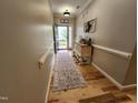 Entryway with hardwood floors, console table, and decorative accents at 1309 Bartlett Cir, Hillsborough, NC 27278