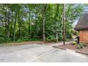 Dedicated parking lot surrounded by mature trees at 192 Summerwalk Cir, Chapel Hill, NC 27517