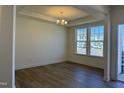 Bright dining room featuring wood floors, crown molding, and large windows offering natural light at 367 Whitley Ridge Dr, Clayton, NC 27527