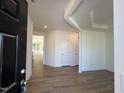 Inviting entryway with wood-look flooring and neutral paint, seamlessly connecting to other living areas at 367 Whitley Ridge Dr, Clayton, NC 27527
