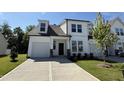 Charming new construction home with white siding, black accents, and an attached two-car garage at 367 Whitley Ridge Dr, Clayton, NC 27527