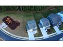 Overhead shot showing a light blue home near a playground and fenced yard in a neighborhood at 391 Curling Creek Dr Dr, Clayton, NC 27527