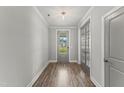Bright entryway featuring hardwood flooring, neutral walls, and a view through the front door at 40 W Victoria Ridge Dr # 18, Selma, NC 27576