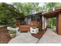 Inviting front porch with wood decking and charming white brick planters at 421 Ridgefield Rd Rd, Chapel Hill, NC 27517