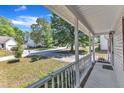 View from front porch overlooking a peaceful neighborhood with lush greenery at 4533 Whistling Way, Raleigh, NC 27616