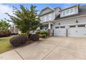 Lovely two-story home with a side entry garage and beautifully landscaped front yard and inviting entrance at 4562 Brighton Ridge Dr, Apex, NC 27539