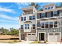 Beautiful townhomes with modern architectural details, front-entry garages, and inviting curb appeal at 509 Sherron Rd # 11, Durham, NC 27703