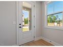 Bright foyer featuring hardwood floors, and view to the outdoors through a glass paneled front door at 509 Sherron Rd # 11, Durham, NC 27703