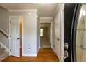 Bright foyer with hardwood floors and neutral paint, offering a welcoming entrance at 716 Lakeview Ave, Wake Forest, NC 27587