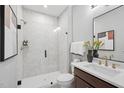 Modern bathroom featuring a glass-enclosed shower with marble tiling and gold hardware at 805 Hyperion Aly, Wake Forest, NC 27587