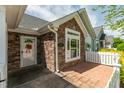 Close-up featuring an entrance framed by attractive stone work and a white picket fence at 924 Carolina Bell Rd, Apex, NC 27502