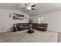 Spacious living room with vaulted ceiling, fan, and a comfortable, oversized sectional sofa at 1574 Dorsett Ln, Creedmoor, NC 27522