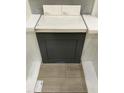 Close-up of cabinetry showing a gray finish with white countertop and light-colored vinyl flooring at 260 Meadowbark Bnd # 44, Garner, NC 27529