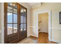 Inviting foyer with a beautiful wood door, hardwood floors, and elegant trim at 2601 Brookstone Ridge, Raleigh, NC 27613