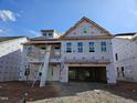 New two-story home under construction with a two-car garage and multiple windows at 3008 Dog Rose Dr # 307, Durham, NC 27703