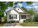 Charming home showcasing a well-manicured lawn and white siding at 303 Godwin St, Selma, NC 27576
