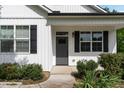 Charming home showcasing a well-manicured lawn and white siding at 303 Godwin St, Selma, NC 27576