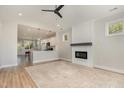 Spacious living room featuring high ceiling, fireplace and open to the kitchen at 303 Godwin St, Selma, NC 27576