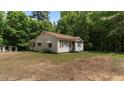 Cozy home featuring a spacious yard perfect for outdoor activities and relaxation at 3899 Warrenton Rd, Henderson, NC 27537
