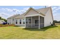 The backyard includes a screened porch and an ample lawn at 504 Winding Creek Dr Dr, Lillington, NC 27546