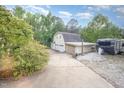 Detached garage with multiple bays and a paved driveway, offering plenty of storage at 515 Poplar Dr, Raleigh, NC 27603