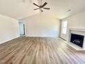 Spacious living room featuring wood-look floors and a fireplace at 138 Sourgum Ct, Zebulon, NC 27597