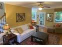 Inviting living room featuring hardwood floors, neutral tones, and comfortable seating arrangement at 14 Striding Ridge Ct, Durham, NC 27713