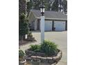 Detached three-car garage with brick facade at 1655 Kingfisher Ct, Nashville, NC 27856
