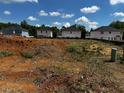 New home construction site in a community with multiple new houses, blue skies and scattered clouds at 243 New Twin Br Ct, Smithfield, NC 27577